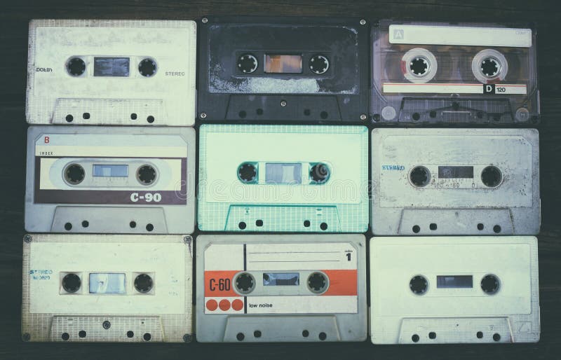 Close up photo of cassette tape over wooden table . top view. retro filtered. Close up photo of cassette tape over wooden table . top view. retro filtered.