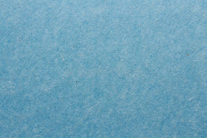 Chiudere con una macro di carta blu da costruzione che mostra fibre di carta di texture difettose e altro ancora. l'immagine perfe fotografie stock
