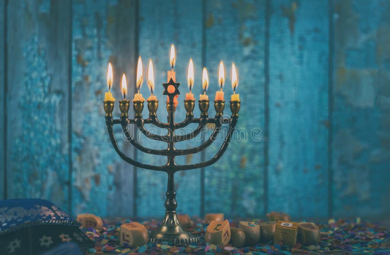 Closeup of a burning Chanukah candlestick with candles Menorah a traditional Jewish holiday, hanukkah, hanukkiah, religion, celebration, judaism, symbol, festival, religious, culture, judaica, festive, hannukah, channukah, chanukkah, glowing, december, bright, chanukkiah, hannukkah, brass, hanukiah, chanukiah, faith, eight, glitter, flame, seasonal, hanaka, hebrew, israel, candelabra, candlelight, holy. Closeup of a burning Chanukah candlestick with candles Menorah a traditional Jewish holiday, hanukkah, hanukkiah, religion, celebration, judaism, symbol, festival, religious, culture, judaica, festive, hannukah, channukah, chanukkah, glowing, december, bright, chanukkiah, hannukkah, brass, hanukiah, chanukiah, faith, eight, glitter, flame, seasonal, hanaka, hebrew, israel, candelabra, candlelight, holy