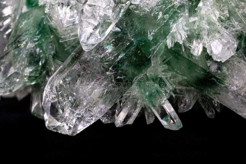 Chlorinated Quartz Crystals, Black Background. Large Crystals Green and