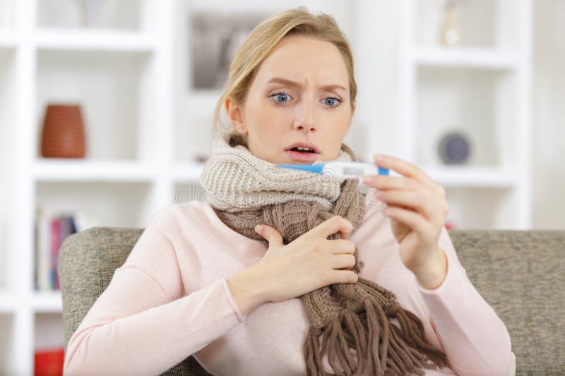 shocked woman being sick having flu lying on sofa couch. shocked woman being sick having flu lying on sofa couch