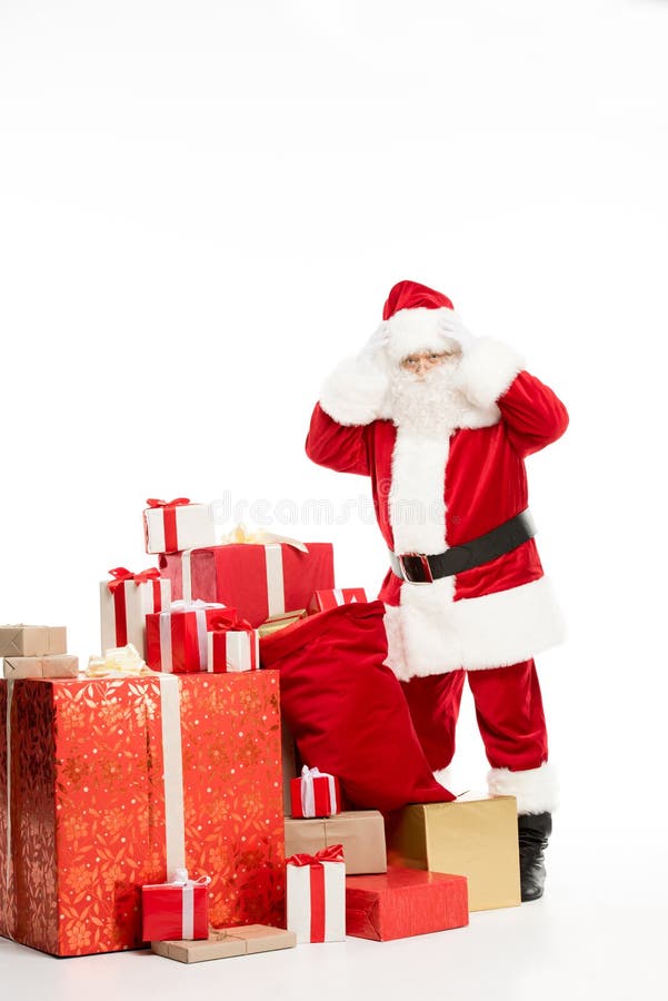 Chockat Santa Claus anseende med julgåvor arkivfoton Chockat Santa Claus anseende med julgåvor arkivfoton