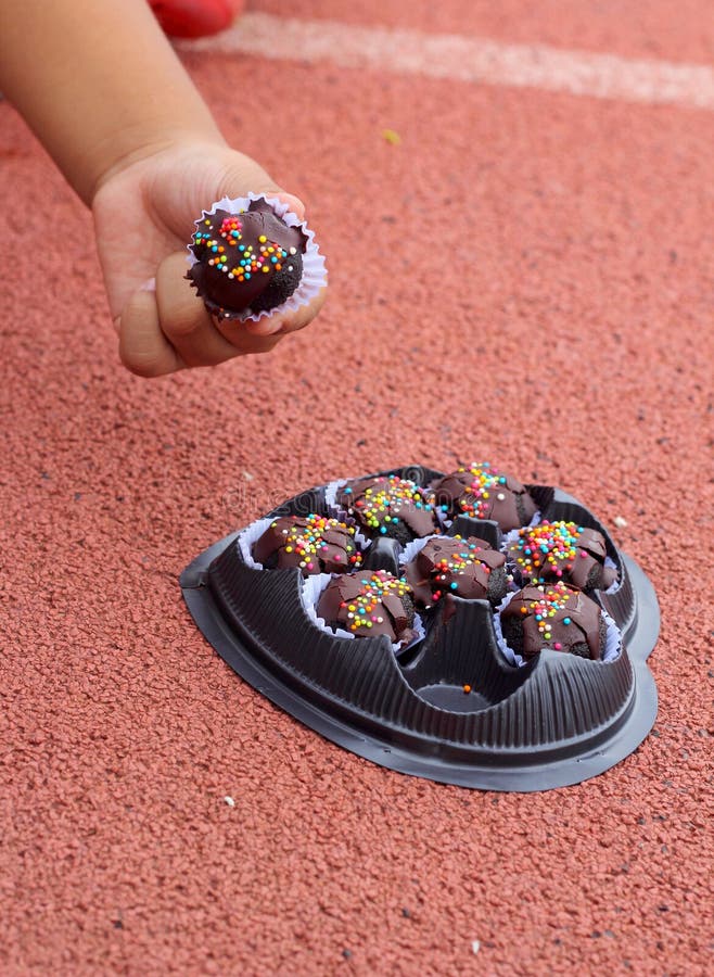 The Chocolate Balls on Hand. Stock Photo Image of closeup, chocolate