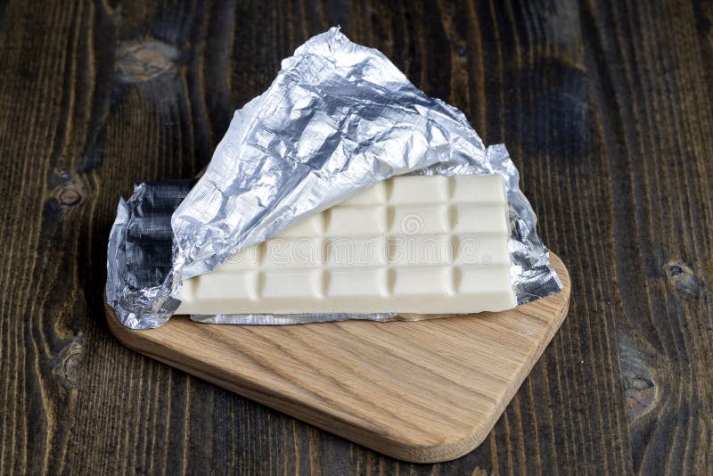 a chocolate bar in an open package of silver foil