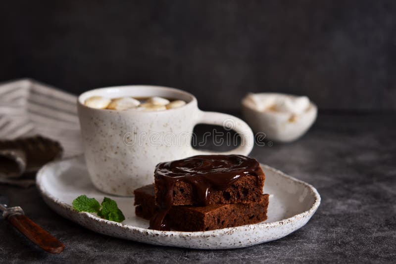 Chocolate Brownie with Coffee and Marshmallows on a Concrete Background