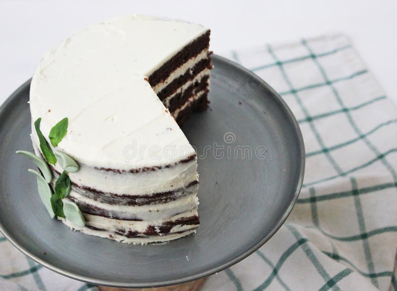 Chocolate Cake with Basil Cream and Passionfruit Syrup Stock Image