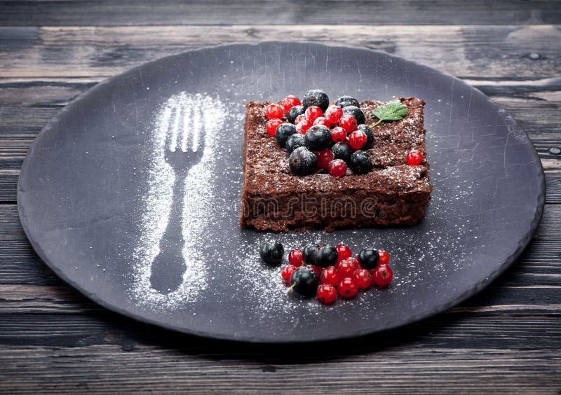 Chocolate cake brownie with summer berries