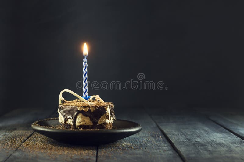 Chocolate cake with a candle and gifts.Happy Birthday, card. Holidays greeting card.