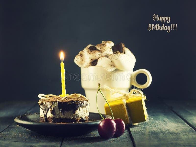 Chocolate cake with a candle and gifts.Happy Birthday, card. Holidays greeting card.