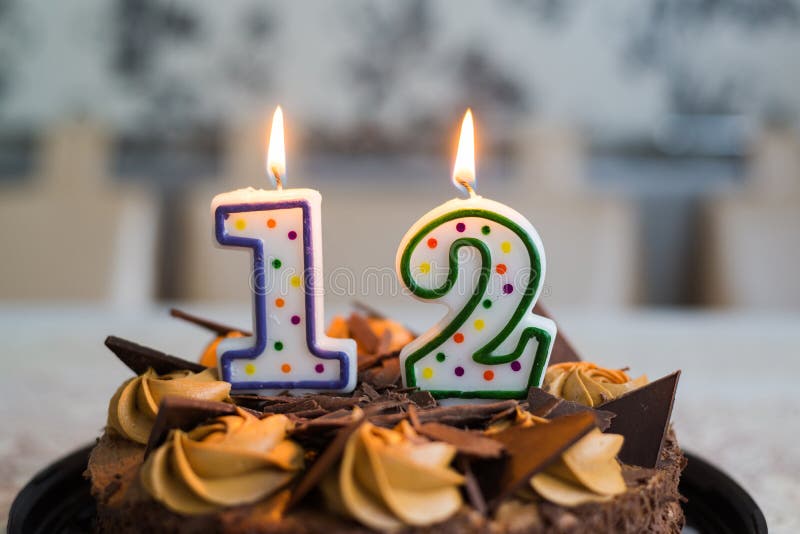 Chocolate Cake with Candles on Day Twelve of Birth Stock Image - Image ...