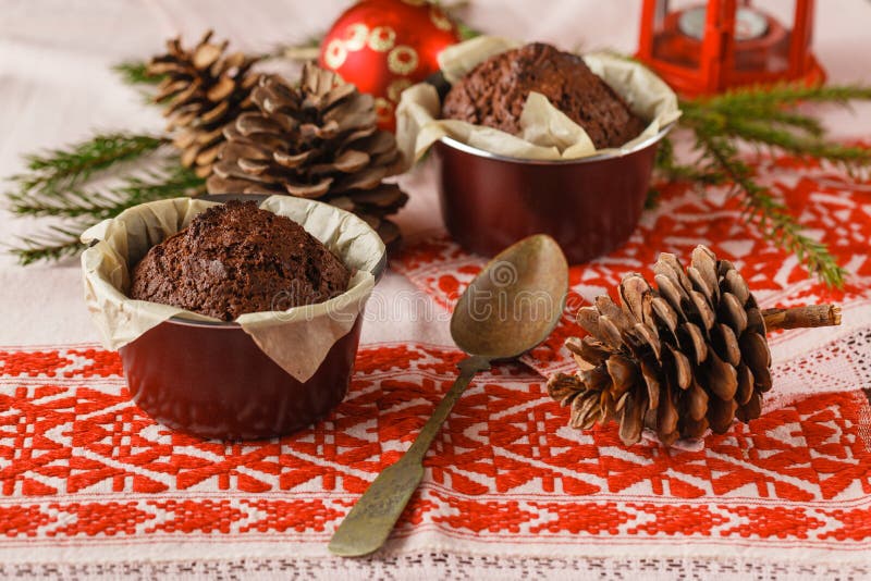 Chocolate cake and little cupcakes with holiday decorations on r stock photos Chocolate cake and little cupcakes with holiday decorations on r stock photos