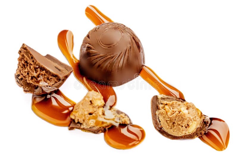 Chocolate candies with melting caramel isolated on white background. Caramel bonbons Top view royalty free stock images