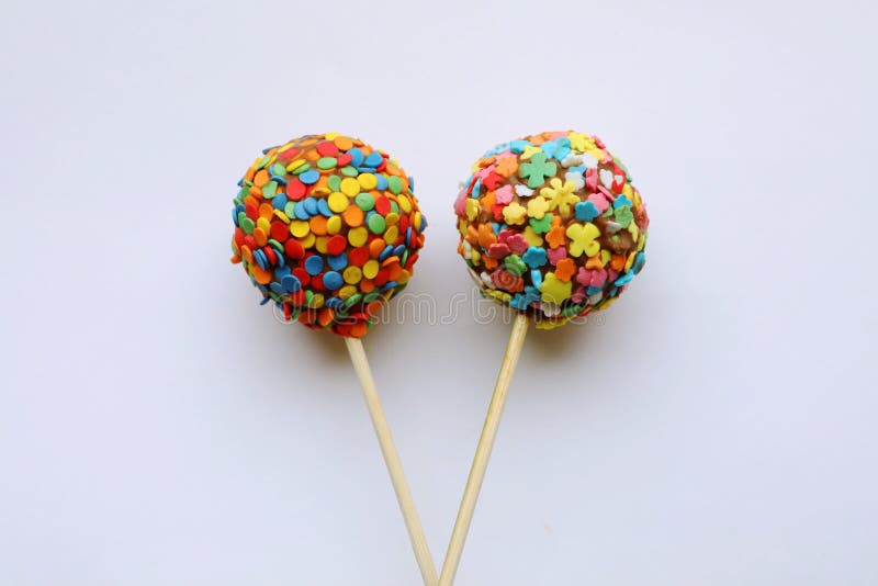 Chocolate candy on a stick stock photo. Image of petal 241980374