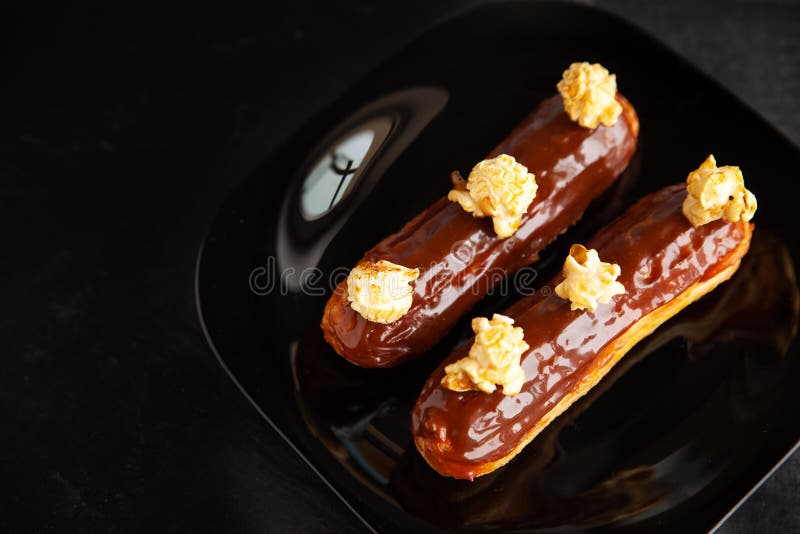Chocolate caramel eclair stock image. Image of french 259969965