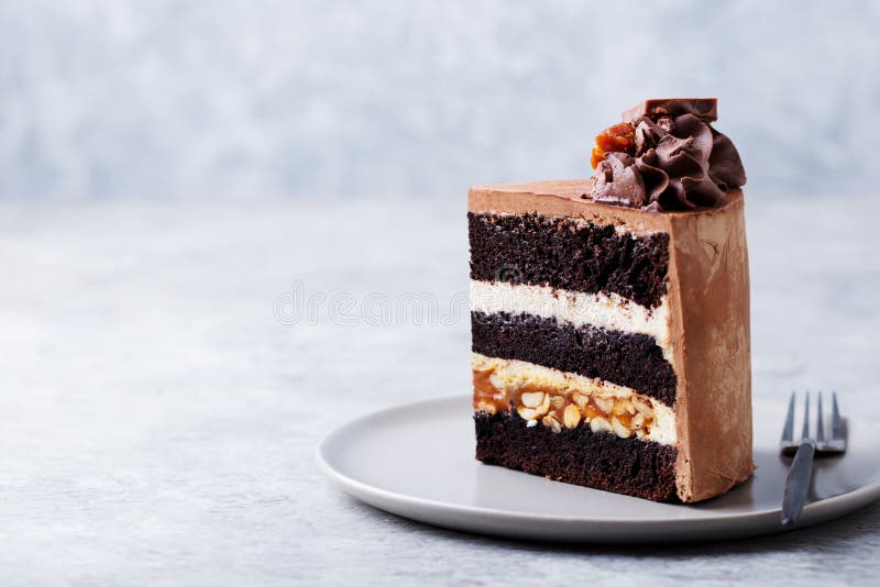 Chocolate Caramel Peanut Cake Snickers On A Plate Grey Background Close Up Stock Image Image Of Cooking Glaze