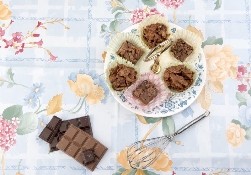Chocolate Cereal Cakes on a Plate with Pieces of Chocolate. Stock Photo