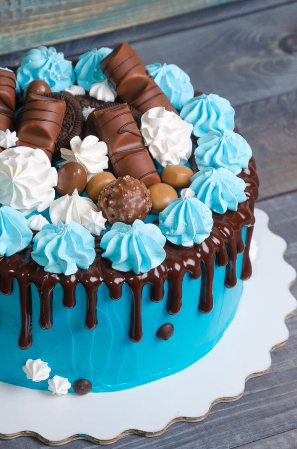 Chocolate Color Drip Cream Cheese Cake with Merengues Stock Image