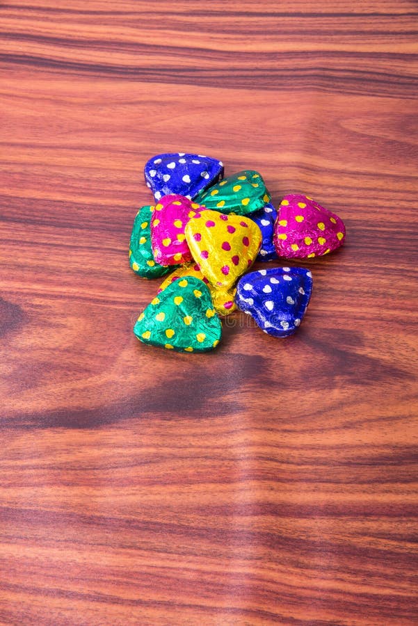 Chocolate or Colorful Heart Shape Chocolate on a Background. Stock