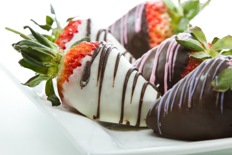 Milk and Dark Chocolate Dipped Strawberries by Godiva Editorial