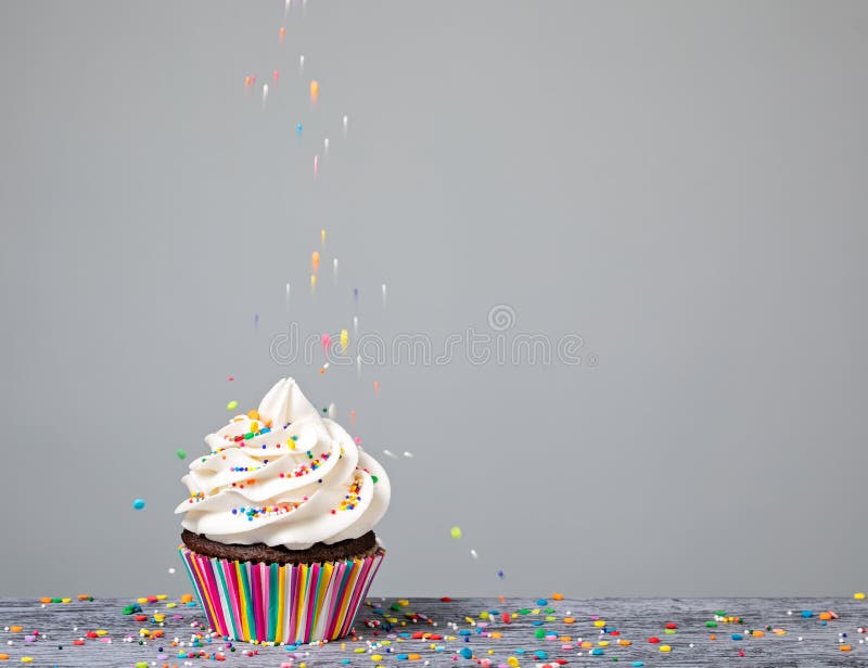Pile of colorful flower sprinkles for cupcakes and ice-cream. Top view,  overhead Stock Photo