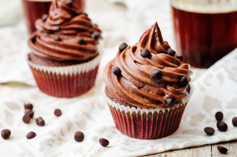 Chocolate cupcakes with chocolate frosting and chocolate chips. The toning. selective focus stock images Chocolate cupcakes with chocolate frosting and chocolate chips. The toning. selective focus stock images