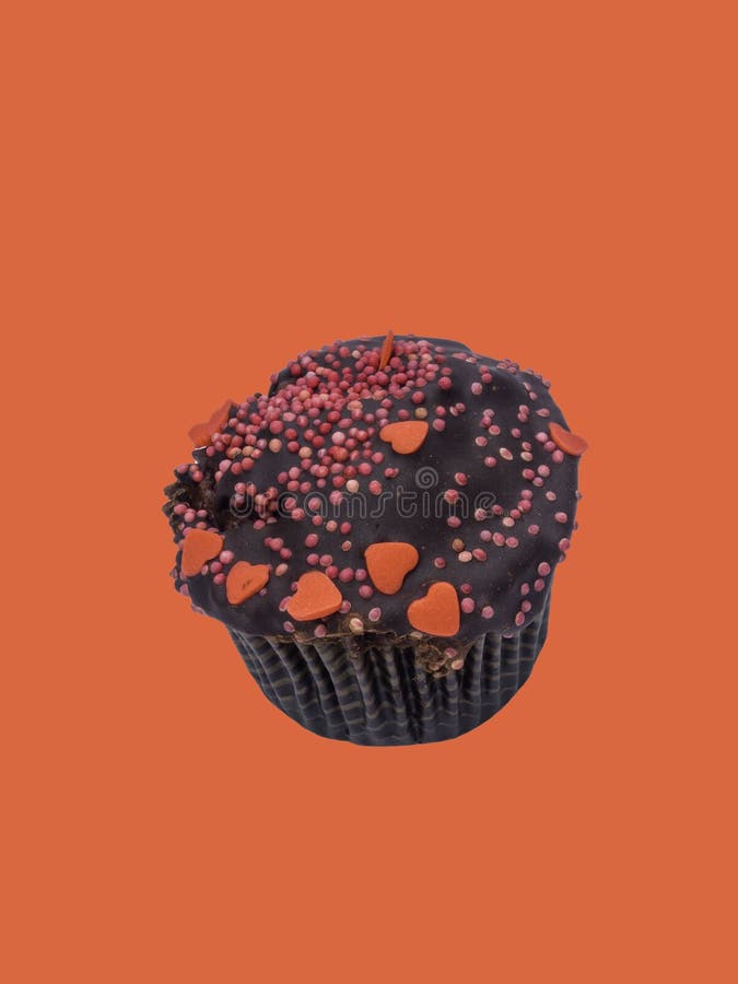 Chocolate cupcakes with frosting sugar hearts, sweet love concept. St. Valentine`s day, birthday, weeding, holiday greeting card on coral color background, copy space