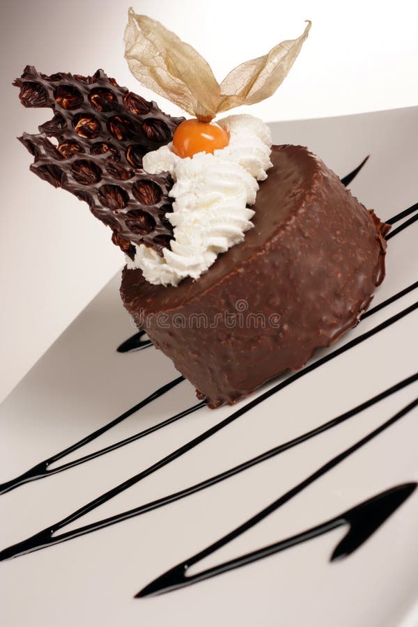 Chocolate dessert with cream and exotic fruit