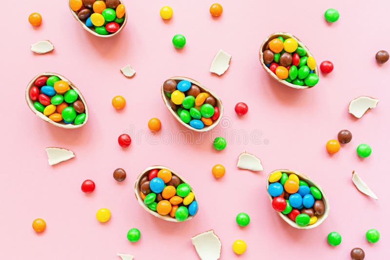 Chocolate Easter Eggs And Colorful Candies On Pastel Pink Paper Background. Flat Lay, Top View ...