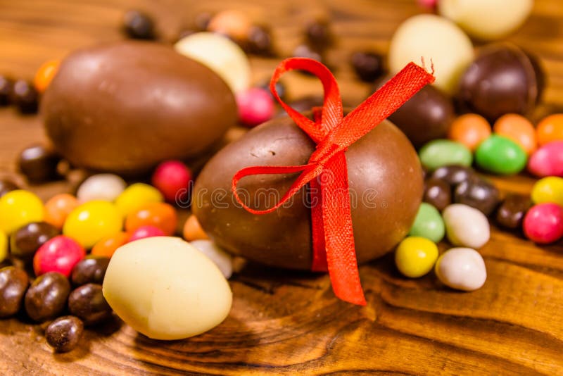 Chocolate Easter Eggs and Multicolored Candies on Wooden Table Stock Photo Image of festive