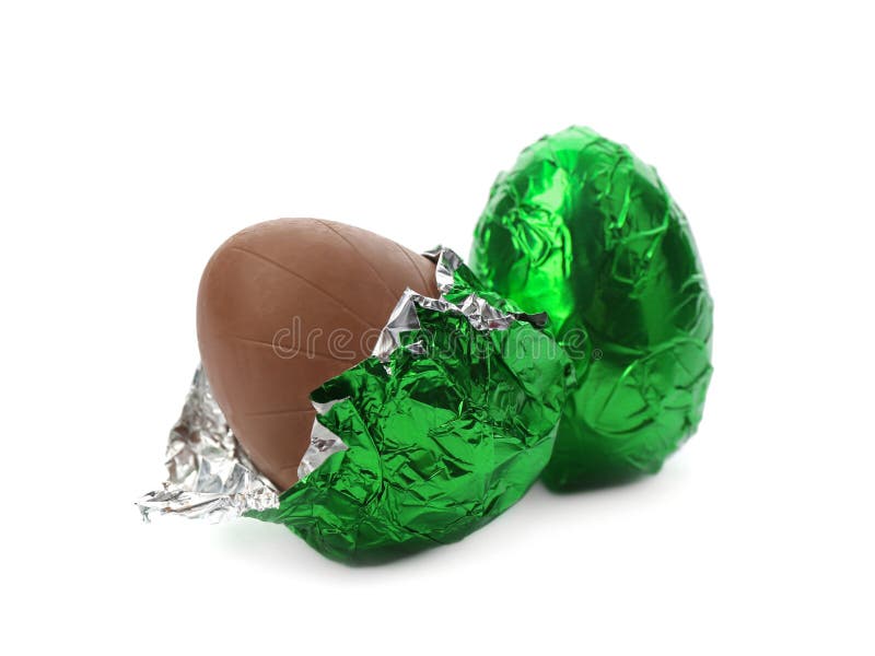 Chocolate Eggs in Green Foil Wrapping on White Background Stock Photo