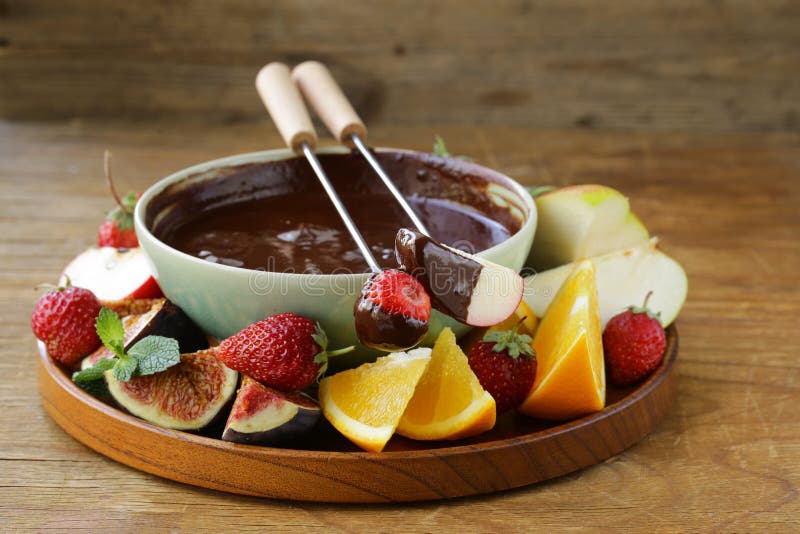 Chocolate fondue with various fruits - delicious dessert