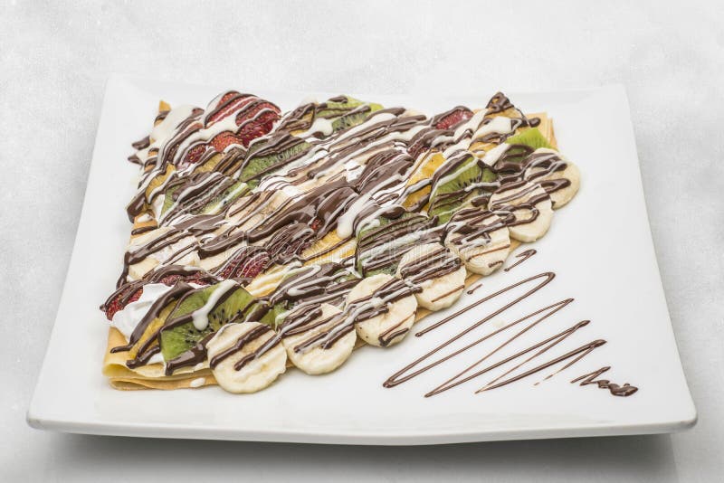 Chocolate & fruits crepe isolated on white background