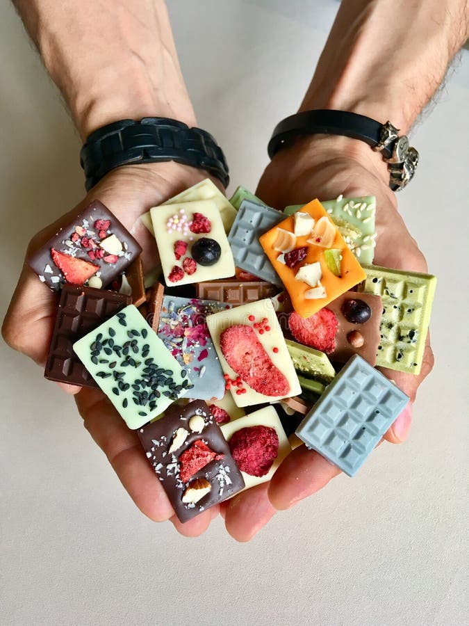 Chocolate in hands macro stock photo. Image of hands 155020878
