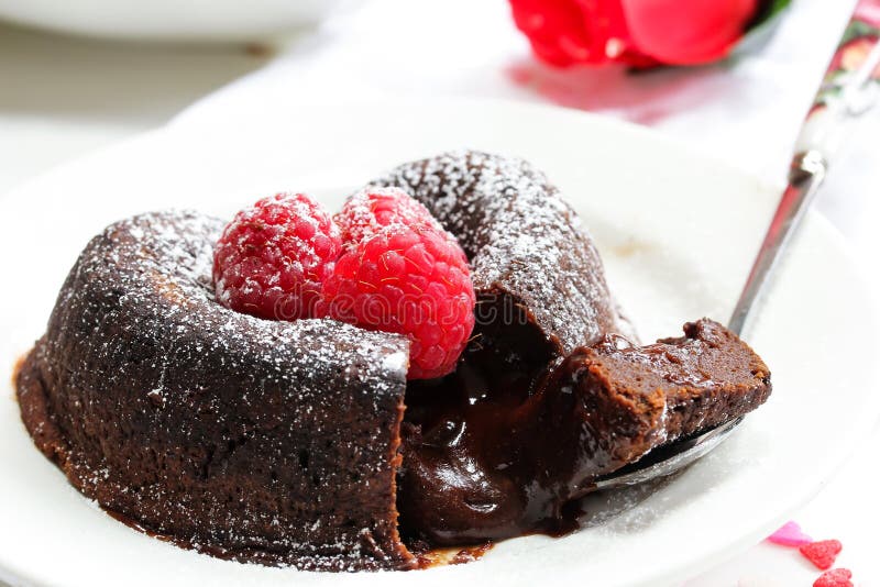Chocolate Lava Cake Heart shaped with raspberry. For Valentines day stock image