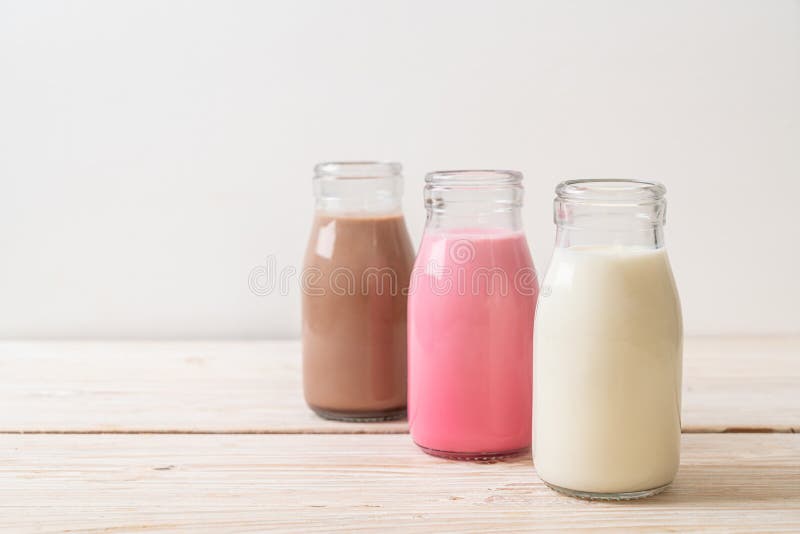 chocolate milk, pink milk and fresh milk in bottle