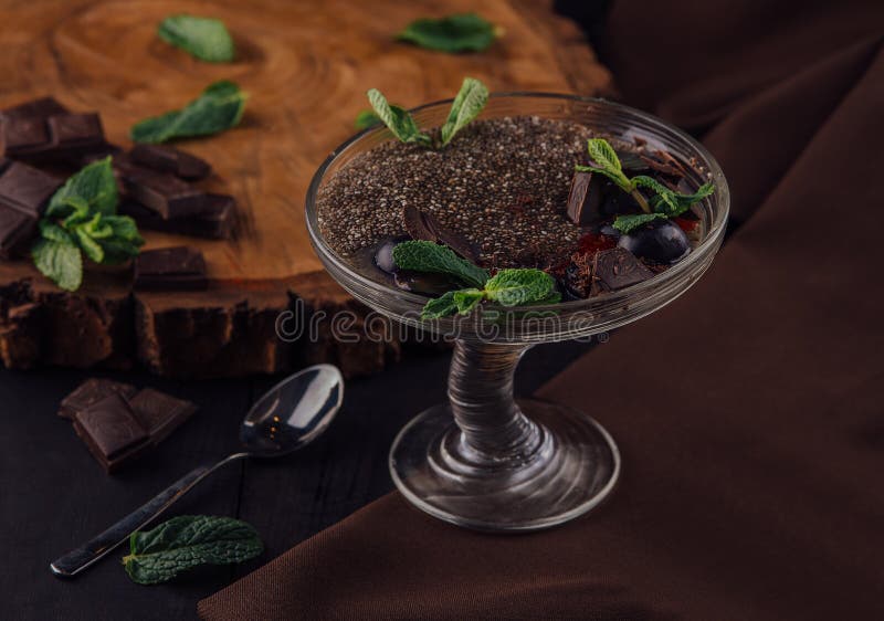 Chocolate Mousse Dessert with Prunes and Mint Leaves in Portion Glasses