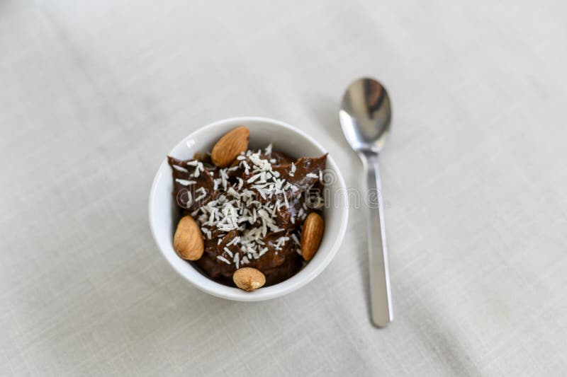Chocolate mousse made from banana and avocado. No sugar, only natural ingredients, dates. Healthy food. Vegan. Mousse is sprinkled stock image Chocolate mousse made from banana and avocado. No sugar, only natural ingredients, dates. Healthy food. Vegan. Mousse is sprinkled stock image