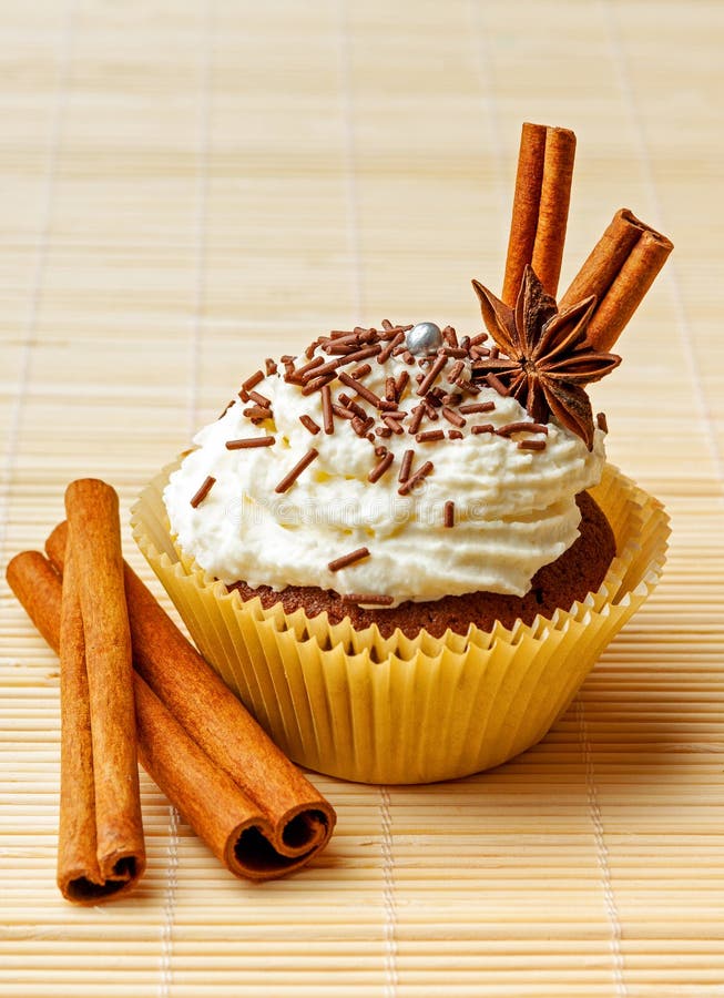 Chocolate Muffin with Whipped Cream, Chocolate Sprinkles and Spices