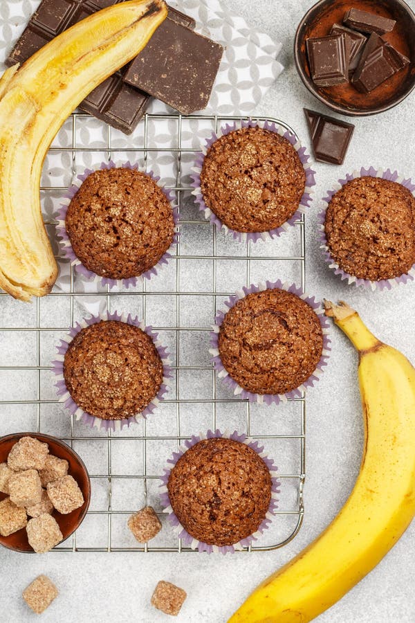 Chocolate muffins with banana and sugar crust on the cooking grill. Fresh homemade pastry stock photos Chocolate muffins with banana and sugar crust on the cooking grill. Fresh homemade pastry stock photos