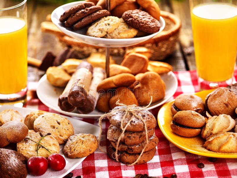 Chocolate oatmeal cookies, sand heart shape cake with orange juice