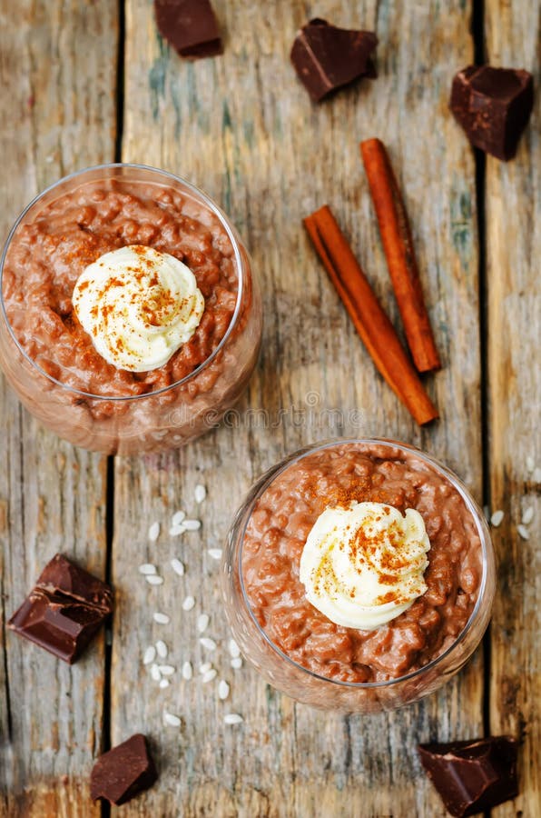 Chocolate Rice Pudding Decorated with Whipped Cream with Cinnamo Stock