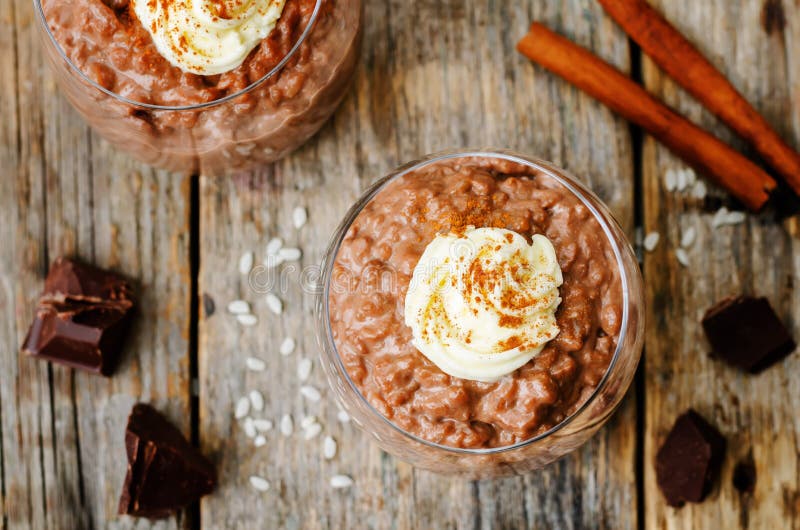 Chocolate Rice Pudding Decorated with Whipped Cream with Cinnamo Stock