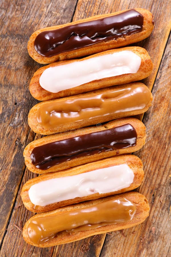 Chocolate, Vanilla and Coffee Eclair Stock Image Image of wood