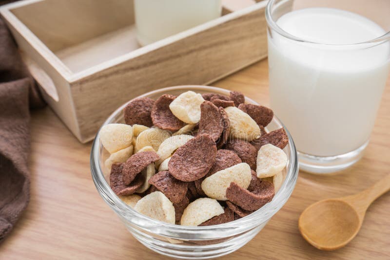 Chocolate and White Chocolate Cereals in Bowl with Milk Glass Stock