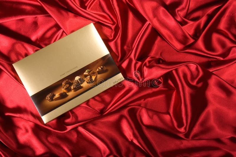 Chocolates box on red satin