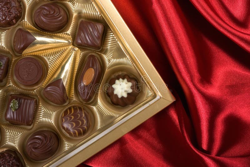Chocolates box on red satin