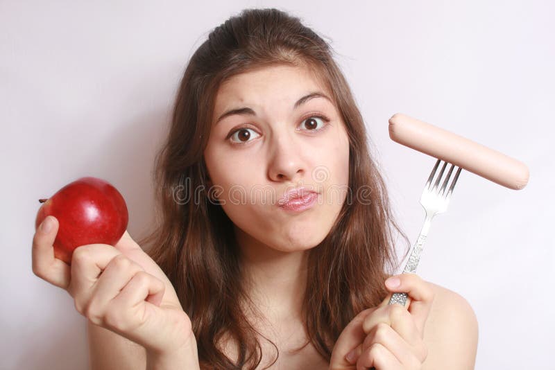 Portrait of the girl, choosing what to eat. Weight watchers stock images, royalty-free photos and pictures