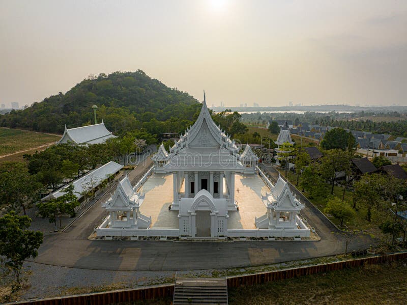 Chonburi, March 12, 2023. Wat Phon Prapa Nimit, This striking white Buddhist temple in a tranquil setting features a silver and royalty free stock image
