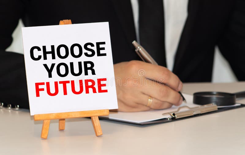 Choose your future written on a memo stick and pen stock image