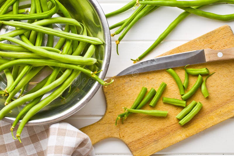 Chopped green beans on kitchen table